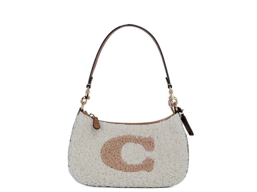 Unveiling Luxury: The Elegance of the COACH Teri Small Shearling Fur Leather Logo Motif Shoulder Handbag