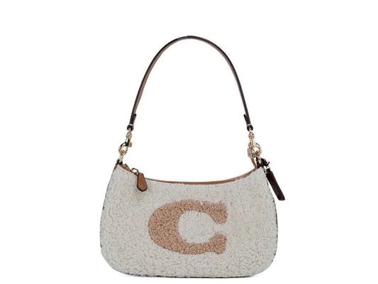 Unveiling Luxury: The Elegance of the COACH Teri Small Shearling Fur Leather Logo Motif Shoulder Handbag