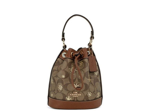 COACH Dempsey 15 Small Snowflake Print Khaki Coated Canvas Bucket Bag