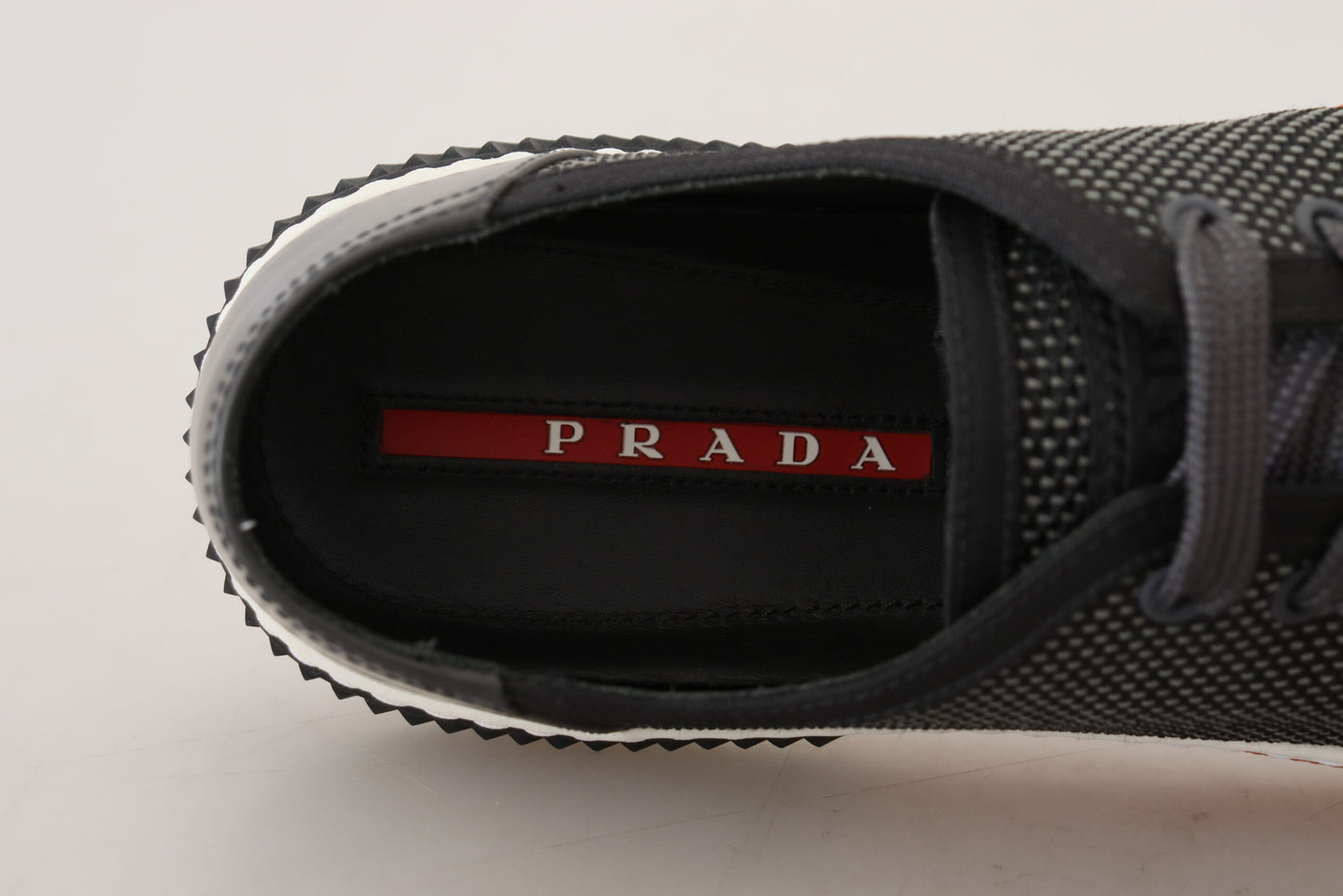 Prada Elevate Your Style with Sleek Gray Low-Top Sneakers