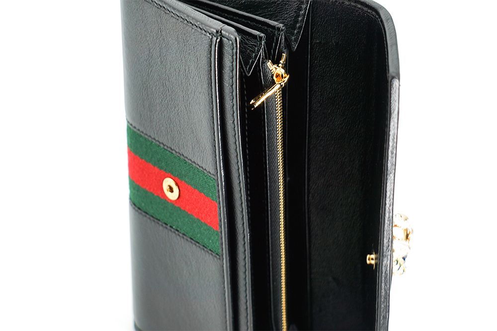 Gucci Elegant Black Leather Wallet with Gold-Toned Accents