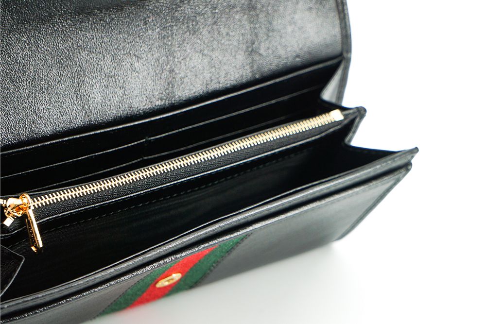 Gucci Elegant Black Leather Wallet with Gold-Toned Accents